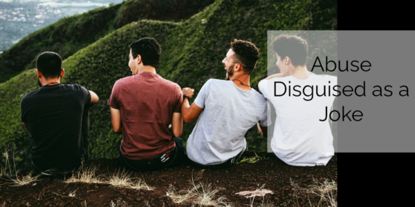 Four men making one man the butt of their jokes